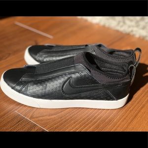 Black slip-on Nike sneakers